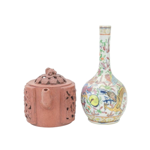 318 - A Chinese Yixing teapot and cover. With reticulated prunus decoration, impressed seal mark, height 1... 