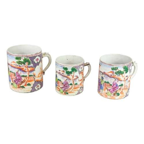 319 - A suite of three Chinese Mandarin pattern export mugs. Qianlong, each also painted with an iron red ... 