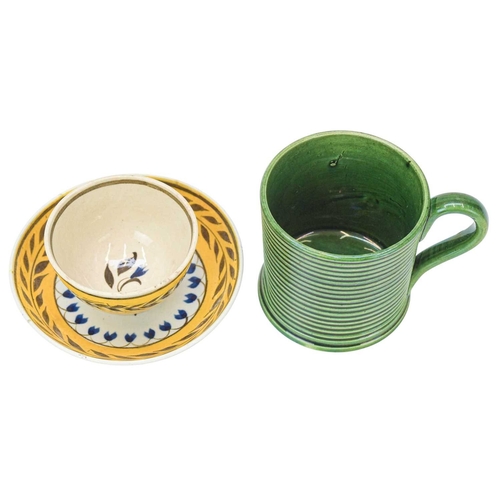 607 - A miniature Pratt type tea bowl and saucer. Circa 1820, centrally painted with a stylised flower, th... 
