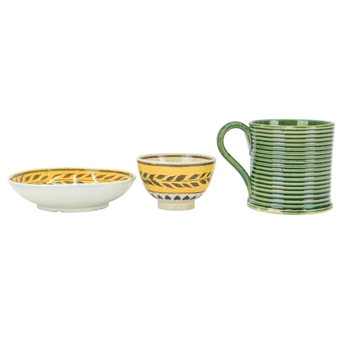 607 - A miniature Pratt type tea bowl and saucer. Circa 1820, centrally painted with a stylised flower, th... 