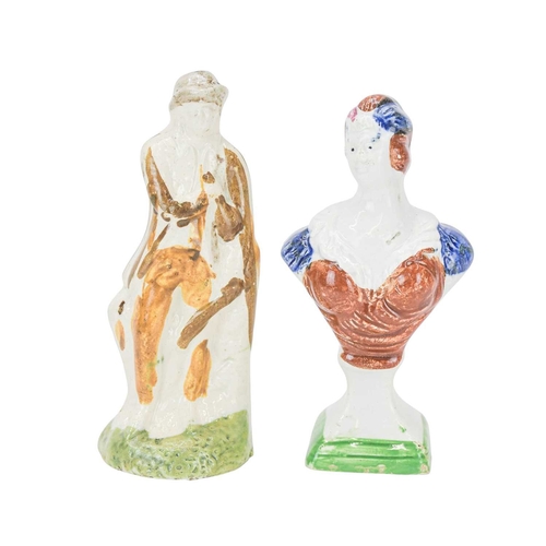 609 - A pearlware slip moulded figure of a man holding a bag. Circa 1820, painted in Pratt colours of ochr... 