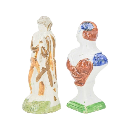 609 - A pearlware slip moulded figure of a man holding a bag. Circa 1820, painted in Pratt colours of ochr... 