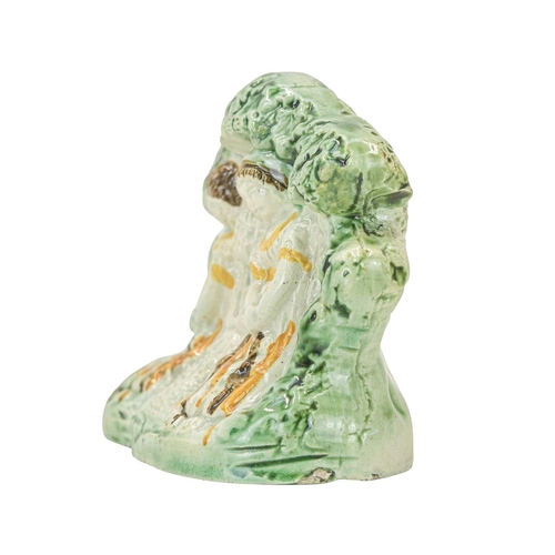 628 - A Staffordshire Pratt ware figure group of the babes in the wood. Circa 1820, with ochre, brown and ... 
