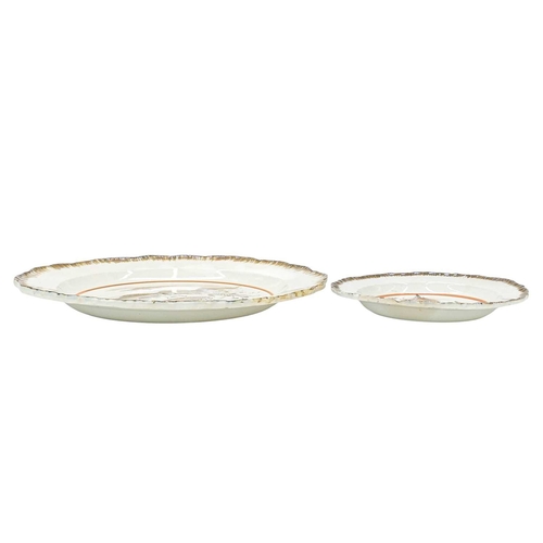 632 - A creamware pottery plate. Probably Yorkshire, circa 1800, with a brown painted feathered edge, pain... 