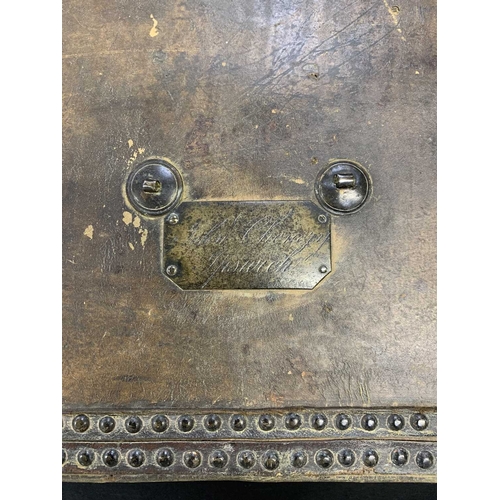 713 - A hide and studded leather covered document box. 18th century, with an applied brass label inscribed... 