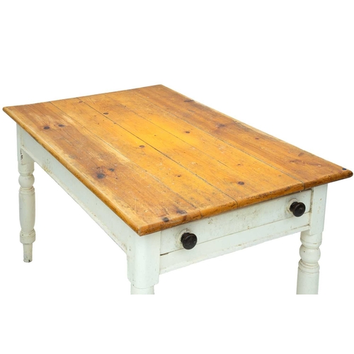 714 - A late Victorian pine kitchen table. The painted base fitted an end drawer and raised on turned legs... 