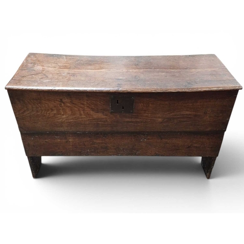 716 - An oak plank coffer. 18th century, with a plank front, and V cut sides, height 59cm, width 103cm, de... 