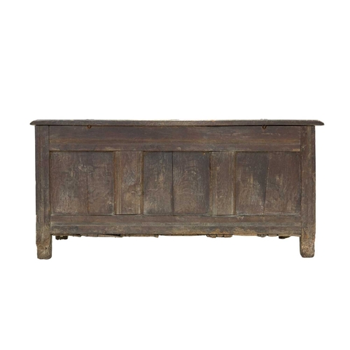 728 - An oak panel coffer. West Country, probably Somerset, 17th century, with a four panel lid above a gu... 