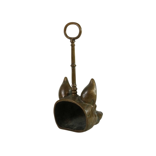736 - A Victorian fox mask heavy brass doorstop. With well cast details and loop handle, height 28cm.