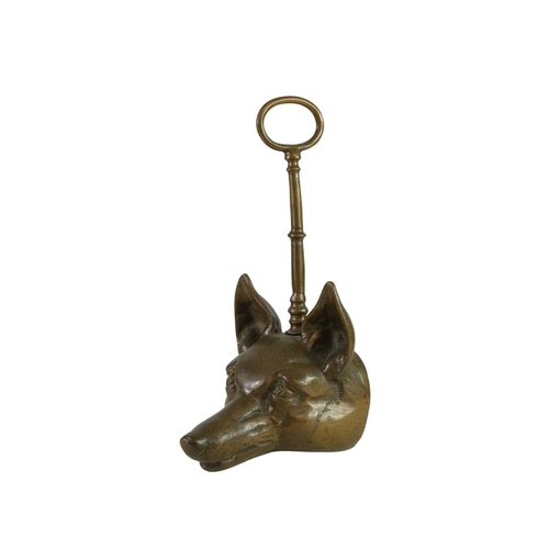 736 - A Victorian fox mask heavy brass doorstop. With well cast details and loop handle, height 28cm.