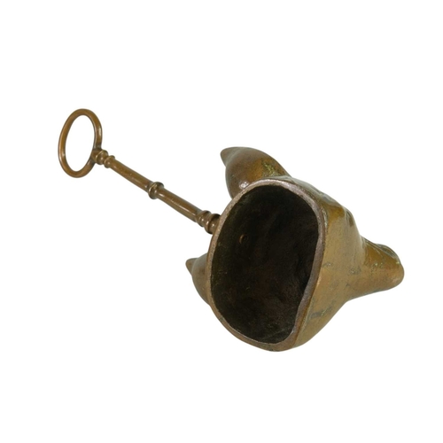 736 - A Victorian fox mask heavy brass doorstop. With well cast details and loop handle, height 28cm.