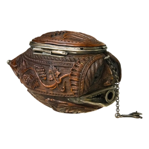 741 - A charming coquilla nut bugbear snuff box. Late 18th century, the base carved an eagle, with vine an... 