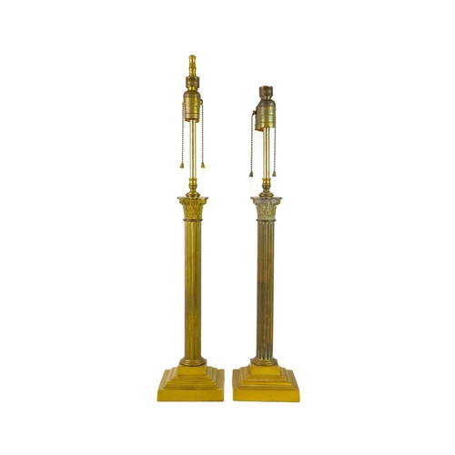 746 - A pair of heavy brass table lamps of Corinthian column form. With adjustable fittings for two bulbs.... 