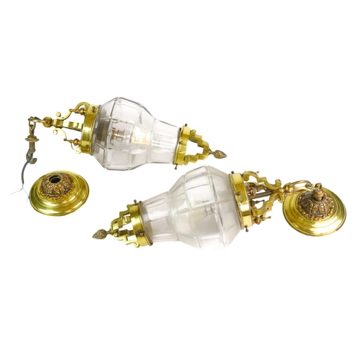 751 - A pair of brass and cut glass hanging light pendants. Early 20th century, the shades with deep cut l... 