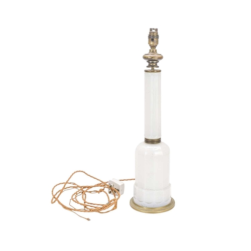 752 - A milk glass table lamp. Late 19th/early 20th century, of mallet form, faceted milk glass colums lea... 