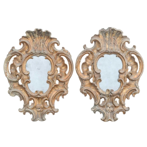 759 - A pair of Italian baroque gilt wood small wall mirrors. 18th century, the shell crests each incorpor... 
