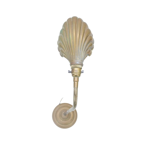 761 - A mid 20th century adjustable brass desk lamp. With an embossed clamshell shade, on a weighted circu... 
