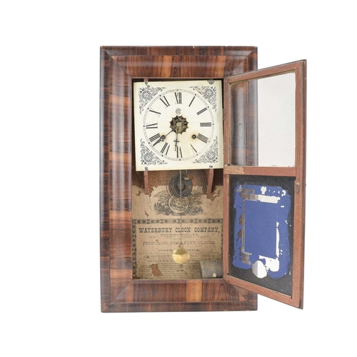 764 - An American 19th century rosewood wall clock. Labelled for the Waterbury Clock Co, with a glazed doo... 