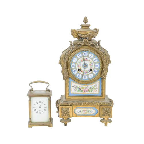765 - A 19th century French mantel clock The gilt brass case with Sevres style painted porcelain panels fl... 