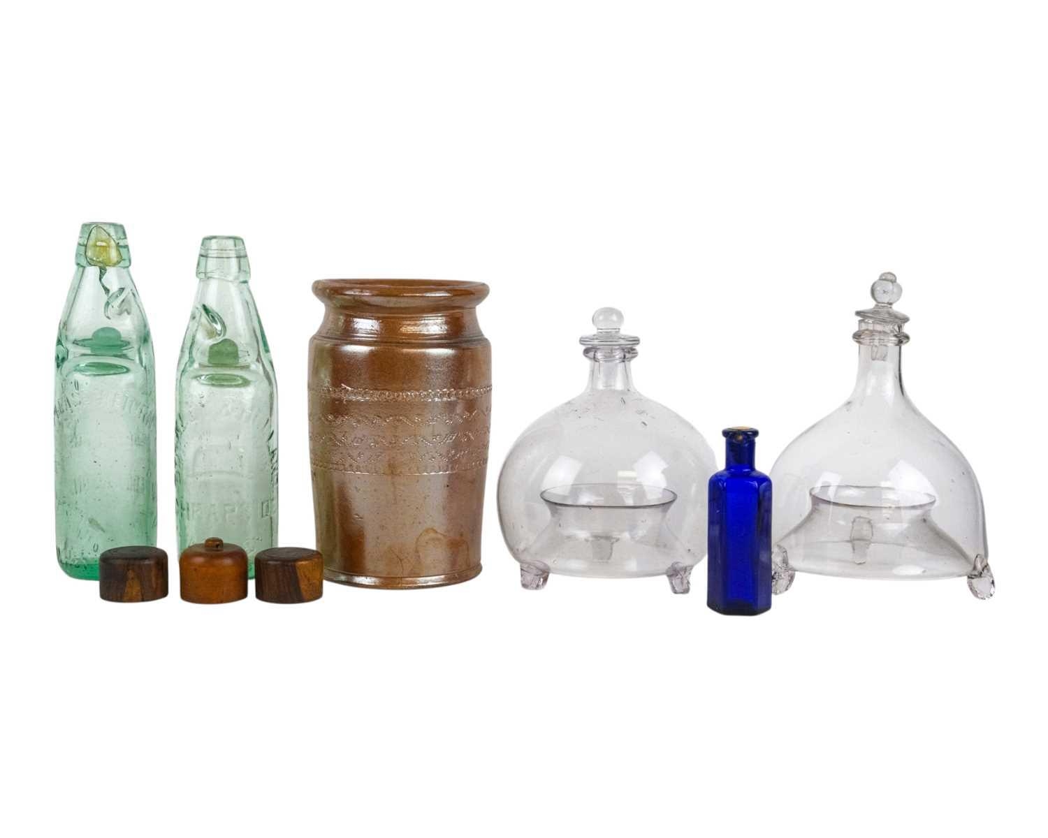 Two Victorian glass wasp traps. Each on three peg feet, height 21cm ...