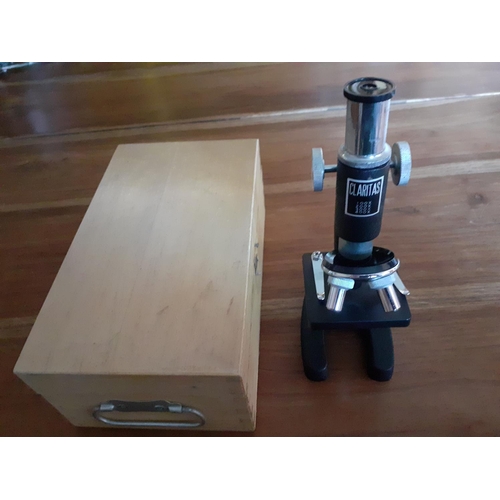 66 - Claritas Microscope in Wooden Box

Stands 19cm tall