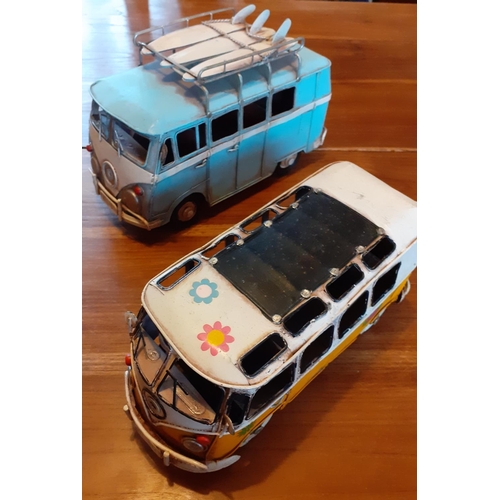 107 - Two VW Camper Van Toy Vans. Largest measures 25cm long.