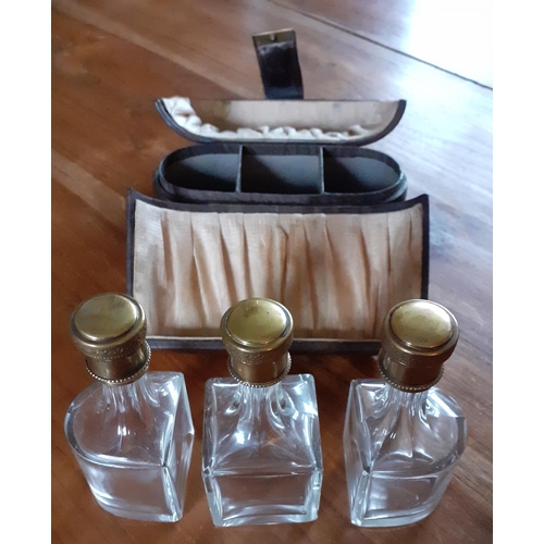 29 - Early Ladies Perfume Leather Travel Case - Three Glass decanters with glass stopper and screw lids i... 