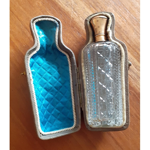 32 - Vintage Ladies Perfume Bottle in Leather Supporting case. Bottle has stopper and lid. Measures 9cm t... 