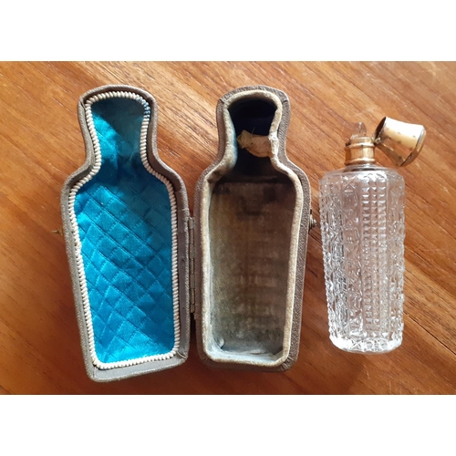32 - Vintage Ladies Perfume Bottle in Leather Supporting case. Bottle has stopper and lid. Measures 9cm t... 