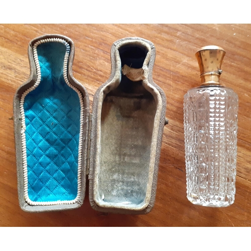 32 - Vintage Ladies Perfume Bottle in Leather Supporting case. Bottle has stopper and lid. Measures 9cm t... 