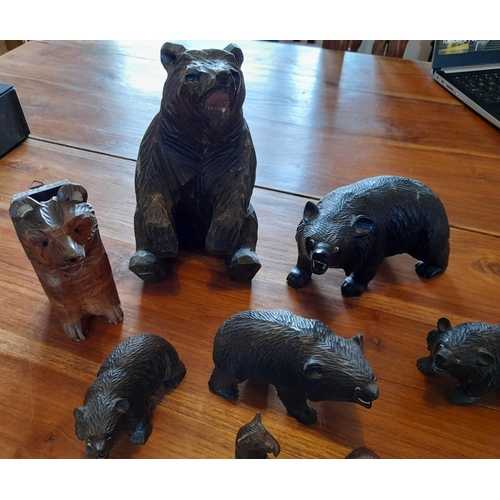 44 - Eleven Wooden Carved Brown / Black Forest Bears. A combination of large and small.