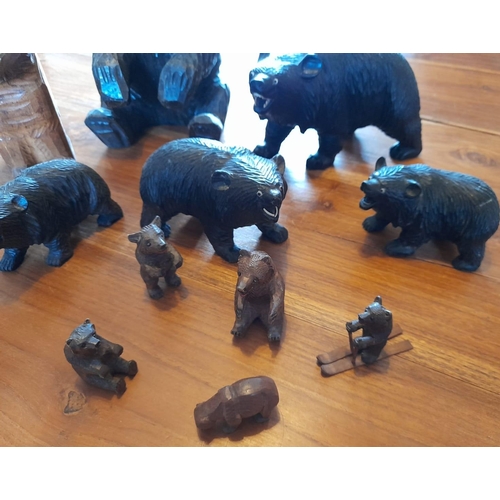 44 - Eleven Wooden Carved Brown / Black Forest Bears. A combination of large and small.