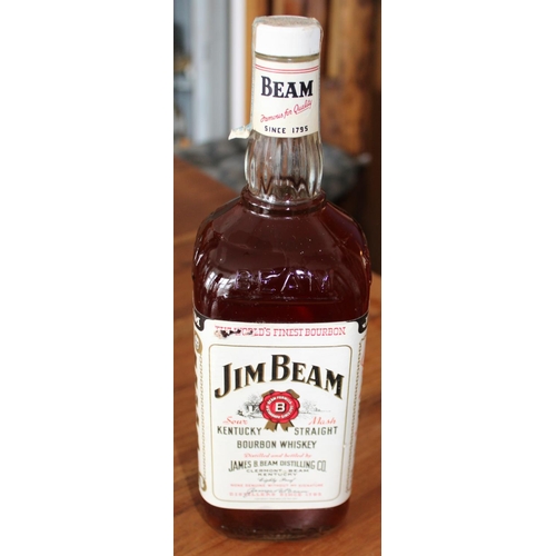 2 - 4 Vintage Bottles of Whiskey and Brandy. Largest Jim Beam bottle is 1.75 litres - All unopened.