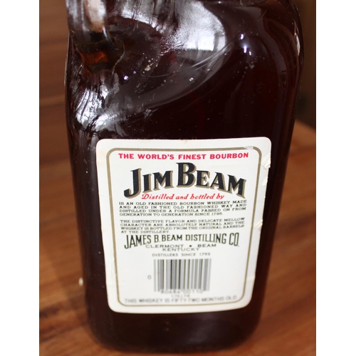 2 - 4 Vintage Bottles of Whiskey and Brandy. Largest Jim Beam bottle is 1.75 litres - All unopened.