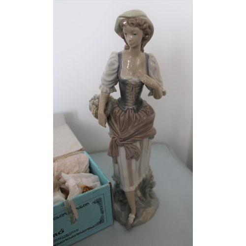 26 - Two Lladro Figurines. Smallest is Sleeping Boy in Original Box. Other is lady figurine measuring 30c... 