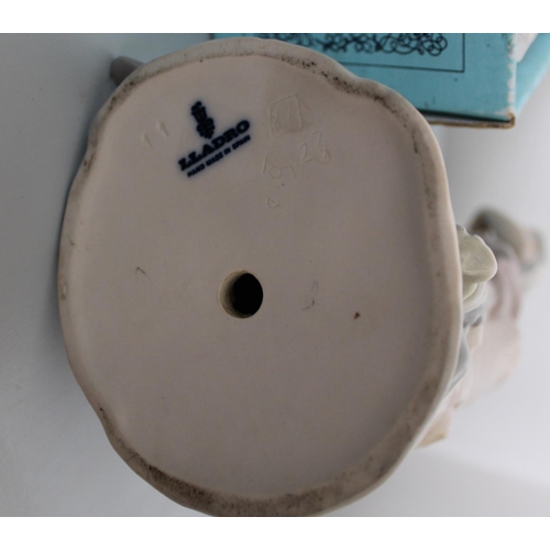 26 - Two Lladro Figurines. Smallest is Sleeping Boy in Original Box. Other is lady figurine measuring 30c... 