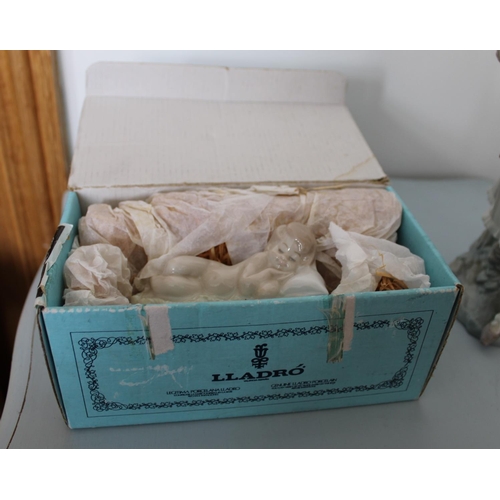 26 - Two Lladro Figurines. Smallest is Sleeping Boy in Original Box. Other is lady figurine measuring 30c... 