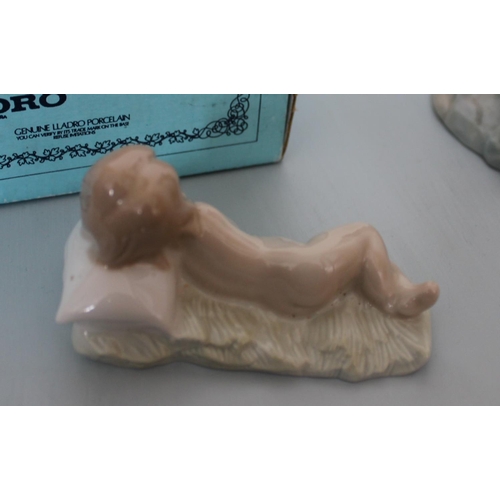 26 - Two Lladro Figurines. Smallest is Sleeping Boy in Original Box. Other is lady figurine measuring 30c... 