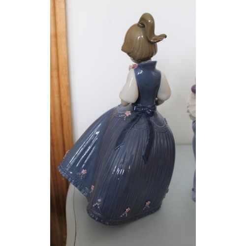 27 - Three Ceramic Figurines. One made by Lladro, One Nao and one from The Regal Collection. Tallest (Lla... 