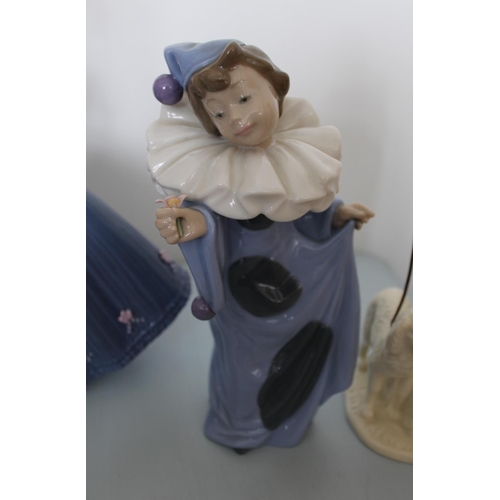 27 - Three Ceramic Figurines. One made by Lladro, One Nao and one from The Regal Collection. Tallest (Lla... 