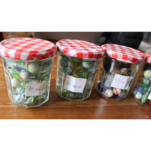 39 - 4 Jars of Collectable Marbles