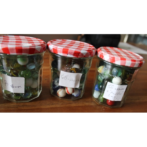 39 - 4 Jars of Collectable Marbles