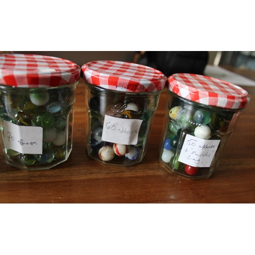 39 - 4 Jars of Collectable Marbles