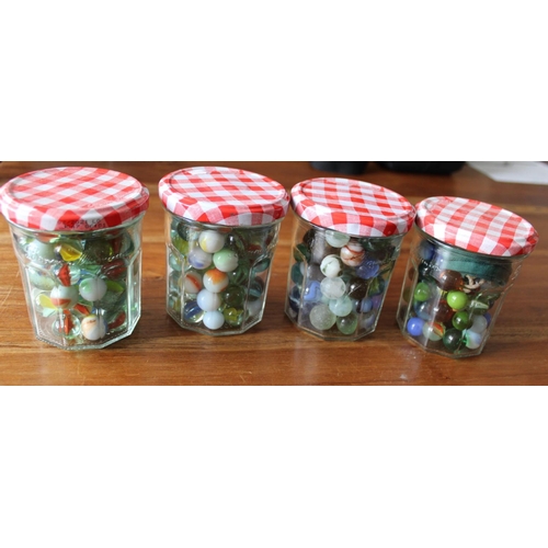 39 - 4 Jars of Collectable Marbles