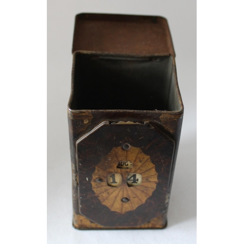 44 - Vintage Tea Caddy with Calendar Wheel on Front. Stands 13cm tall by 7.5cm wide approx