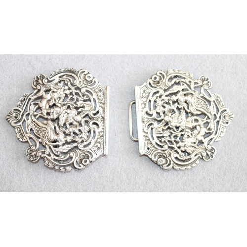 554 - Pair of Silver Belt Buckles
Length-6.5cm Each