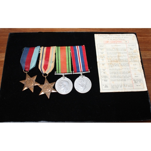 129 - WWII Group of Four Medals with Entitlement Slip.

British War, Defence, 1939-45 and Africa Star Meda... 