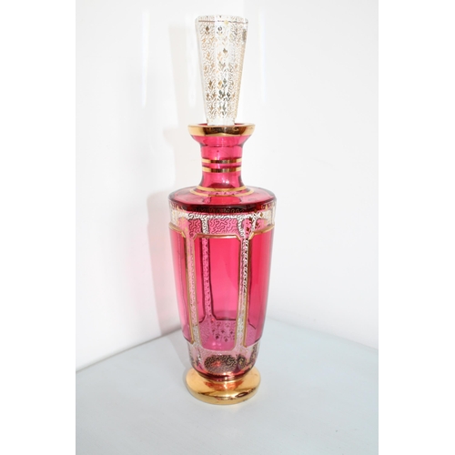 719 - Decorative Cranberry & Gold Glass Decanter 
Height-29.5cm
Some Chips To Lid As Shown In Pictures
All... 