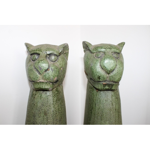 96 - Pair of Wooden Collectable Cats

Measures 62cm Tall