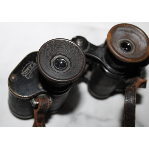 10 - Two Pairs Of Binoculars (Untested)
One Carl Zeiss Jena Multi- Coated Jenopiem 8 x 30 W
One Optica 8 ... 